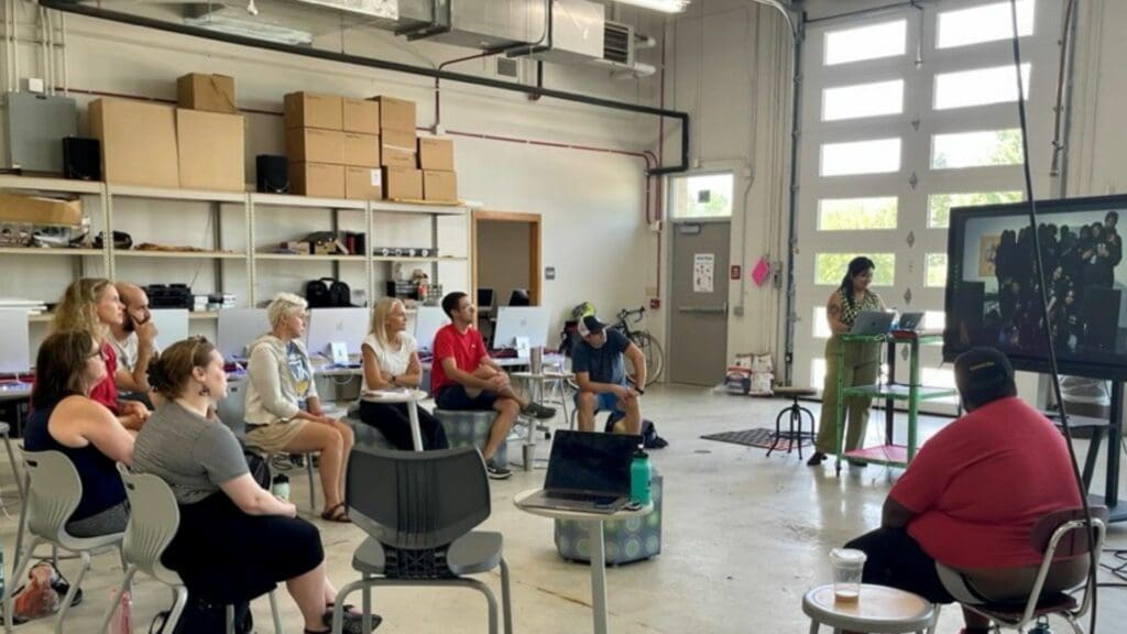 Students listening to teacher in a hands-on program on recording arts at a Wisconsin high school