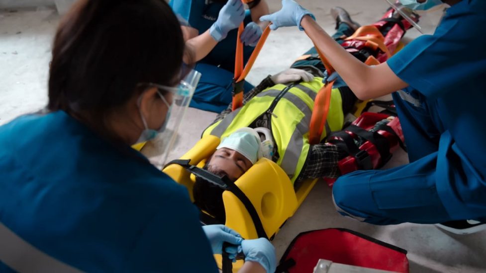 EMTs working with injured person