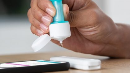 Ellume-COVID-19-Home-Test_Adult-drops-into-analyzer-scaled