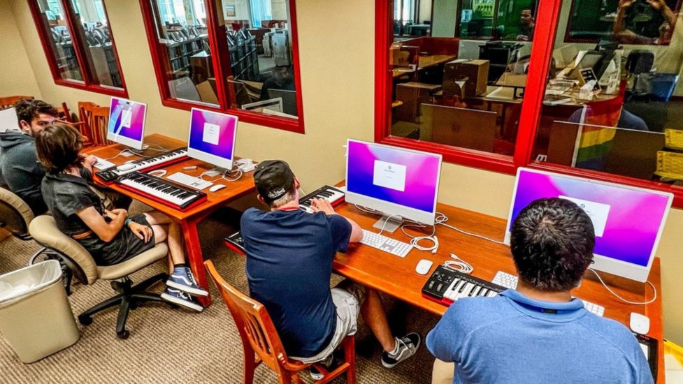 Students at High School for Recording Arts learning to edit music on a computer