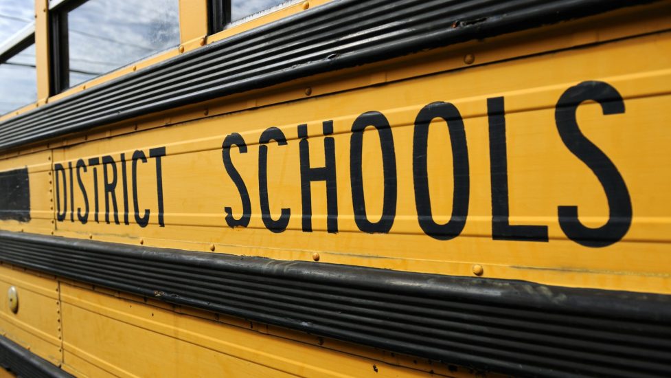 Side,Of,An,Old,Yellow,School,Bus,In,Governor's,Harbour,